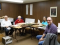 Legacy volunteers and a grad student sort the archives